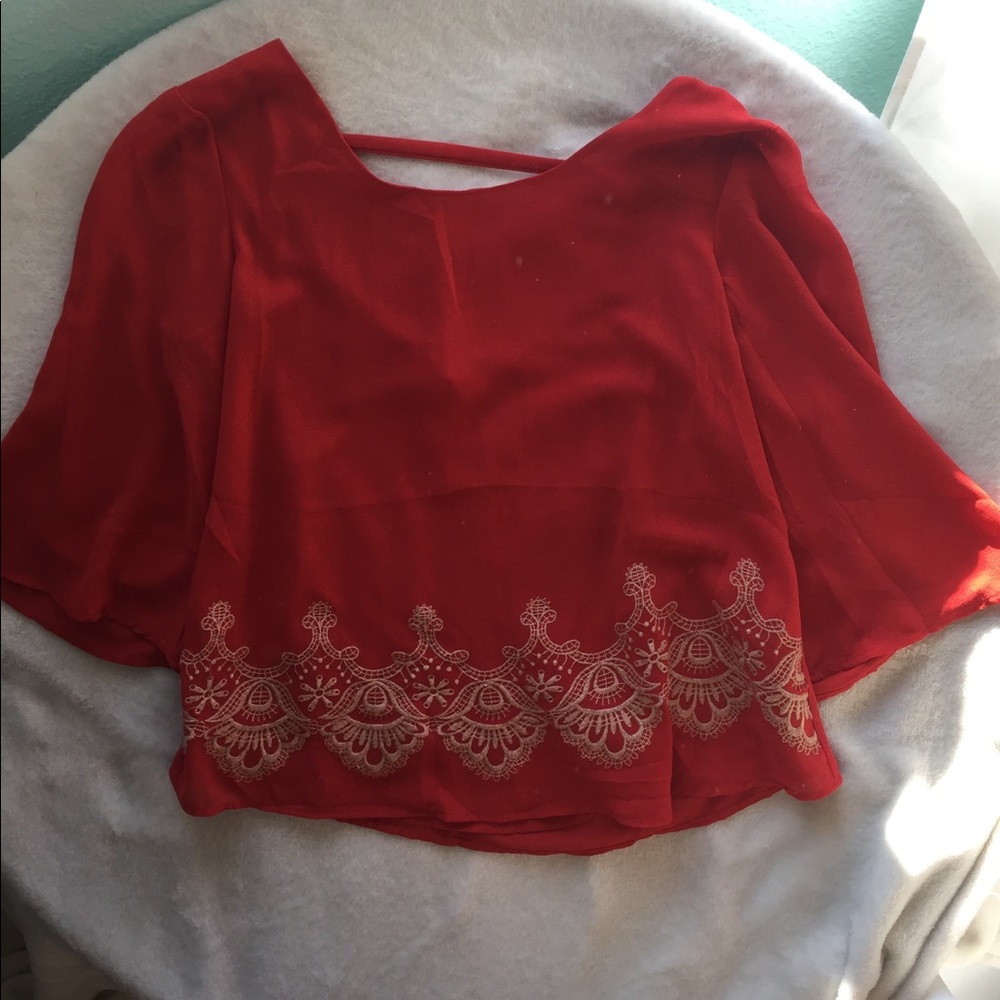 Orange top with gold embroidery